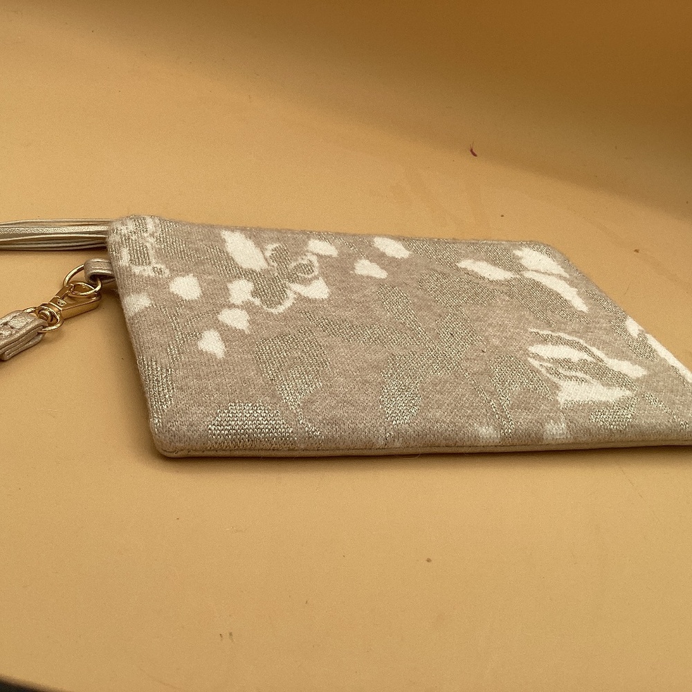 Cynthia Rowley wristlet bag with tassel.